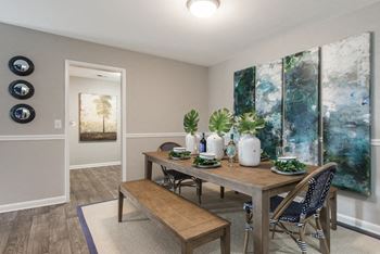 Apartments In Sandy Springs, GA for Rent – Celebration at Sandy Springs - a dining room with a table and chairs